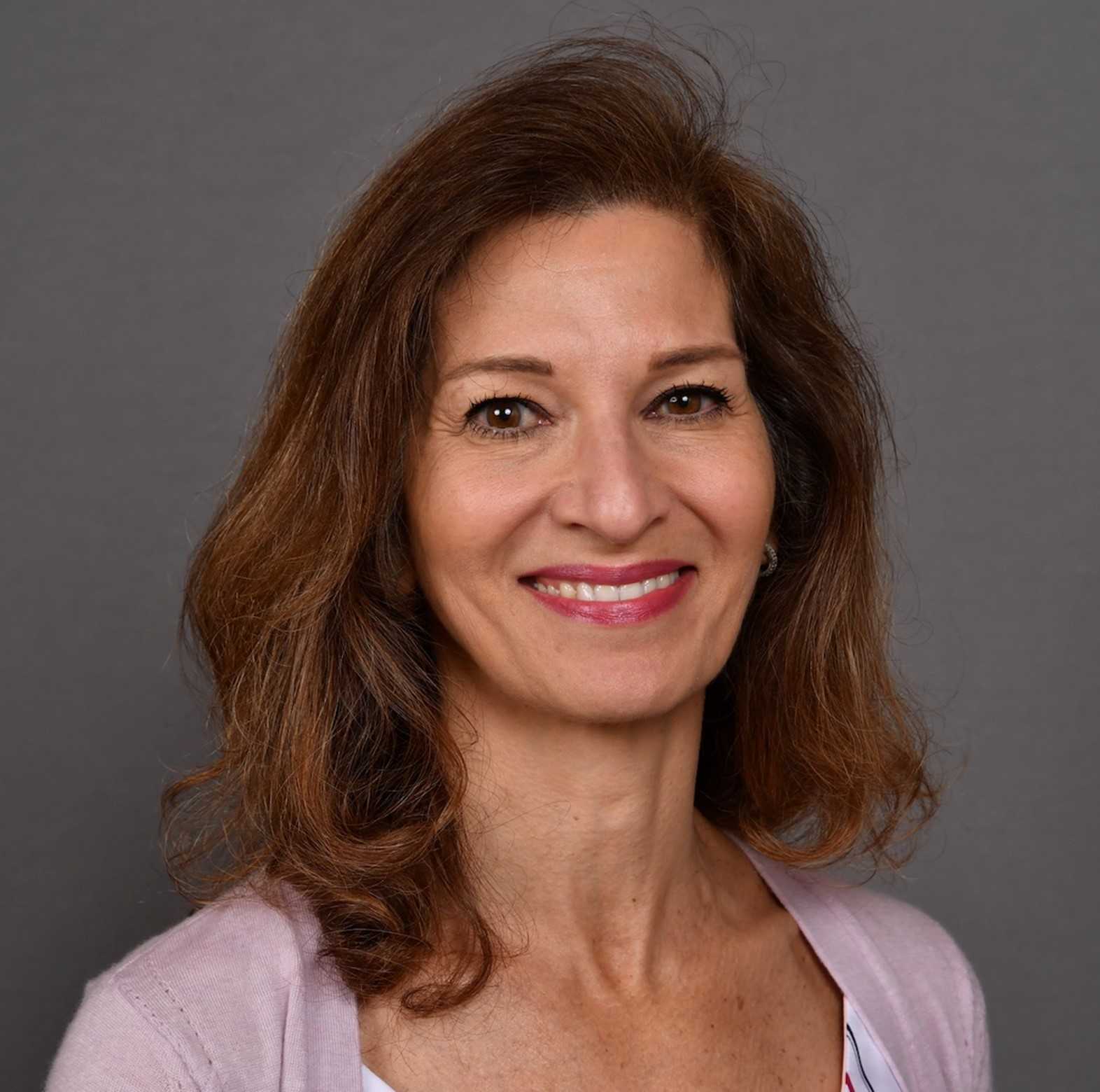 Nurse placing EEG electrodes onto patient